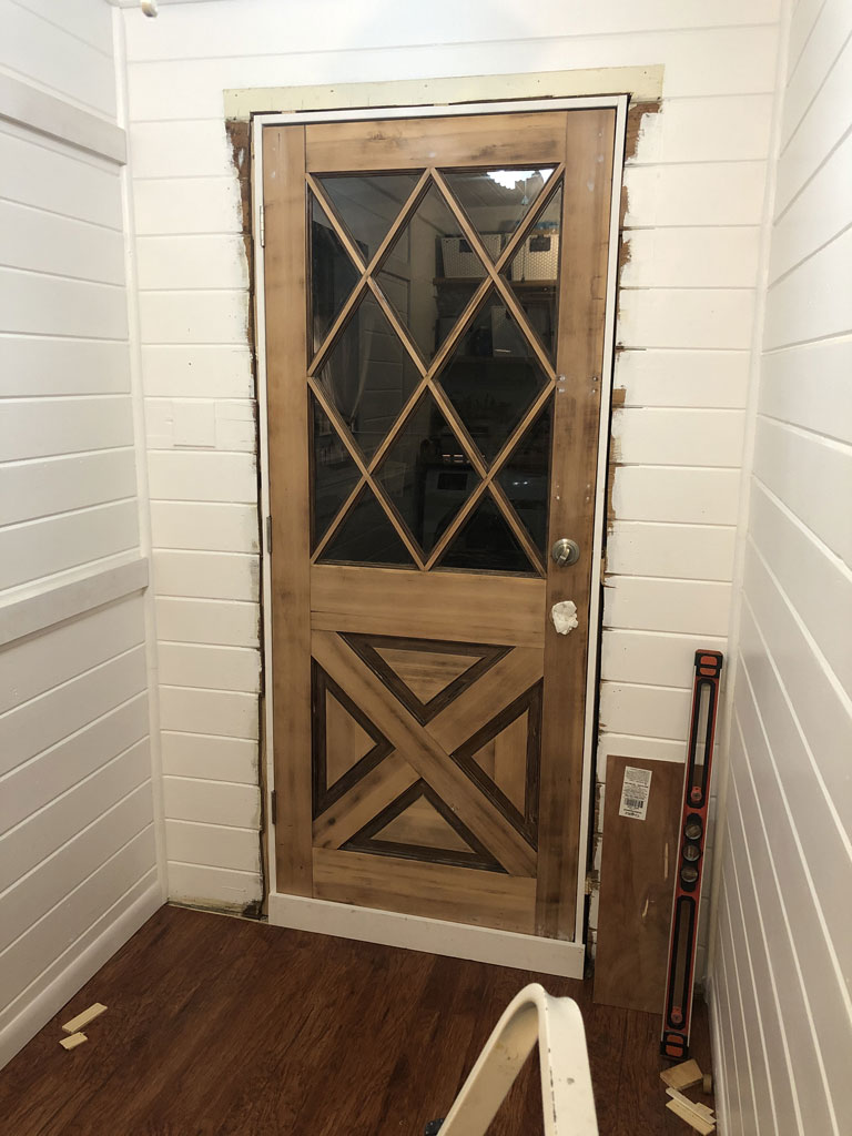 new wood half lite door partially installed