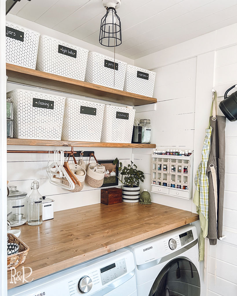 organized shelves above wood laundry counter