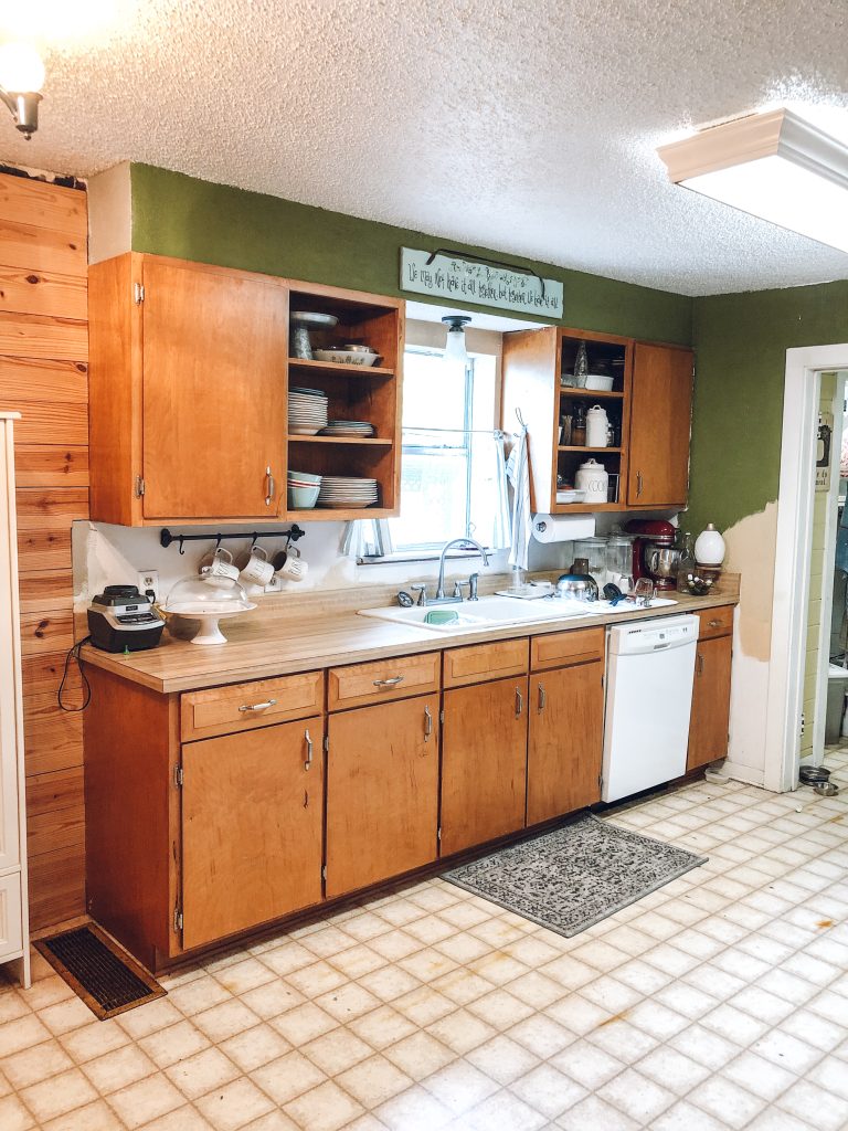 Orange toned cabinets, sink and dishwasher