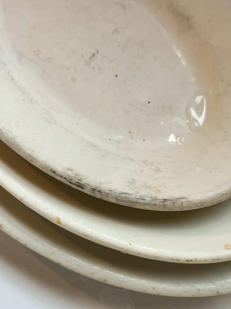 dingy white thrifted platter with gray marks