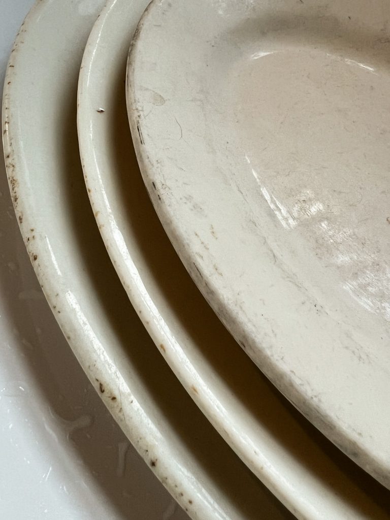 dingy white thrifted platter with gray marks