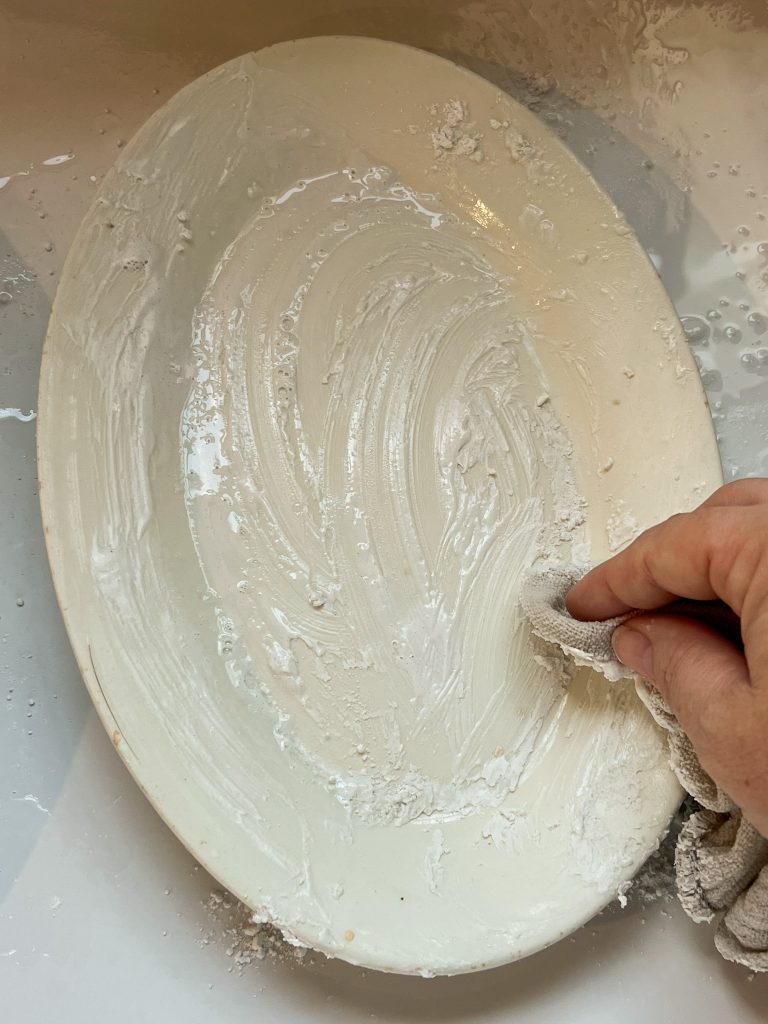 White platter covered with cleaning paste